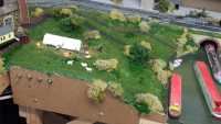 Rebuilt scenary with grass and bushes.